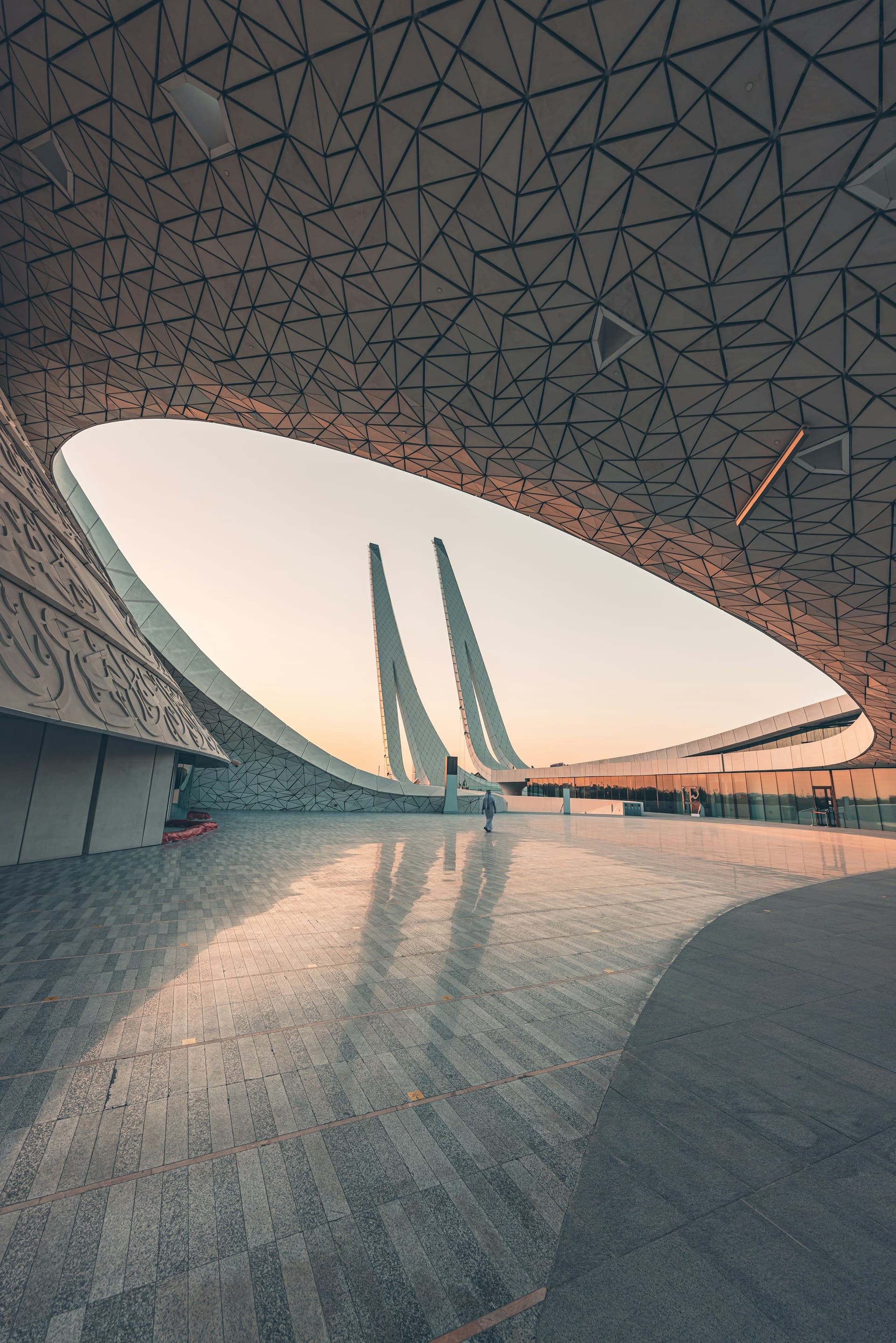 Top Banner showing people walking inside the Islamic Studies Faculty of Qatar